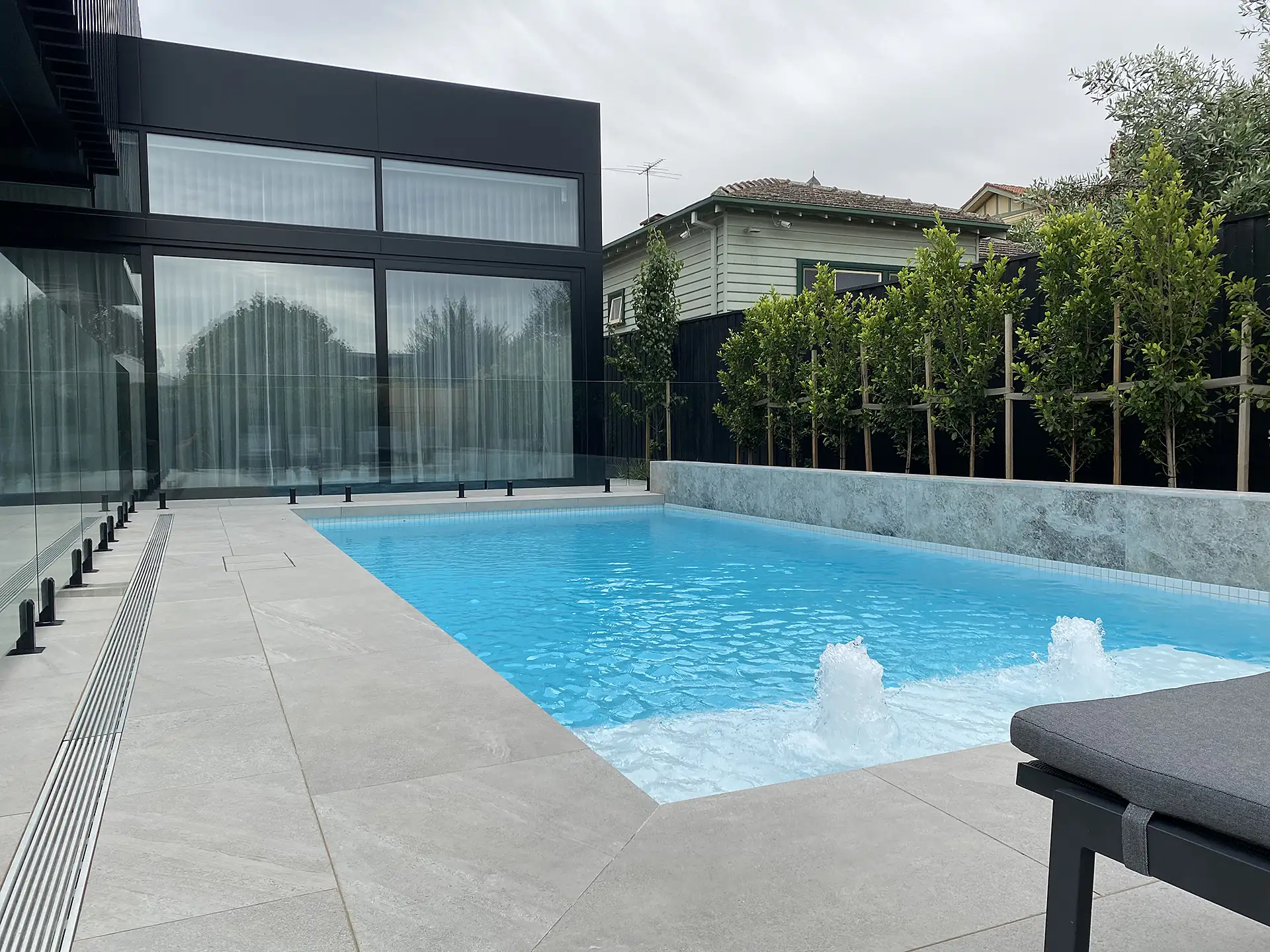 Noosaville Project porcelain pool tiling with Screening Hills Fig to the boundary