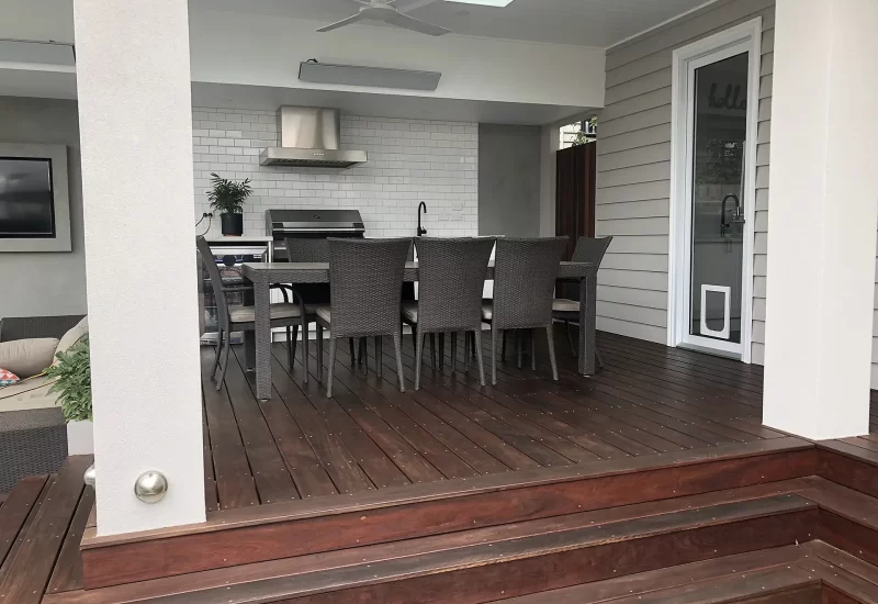 Minyama Project outdoor living space with merbau Decking, render finishes and subway tiles.